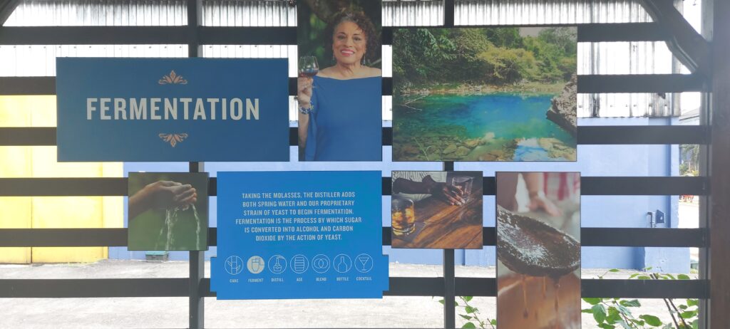 A display at the fermentation station shows the Appleton Estate master blender’s picture in the center, surrounded by panels and visuals of the different elements that contribute to the rum fermentation process.