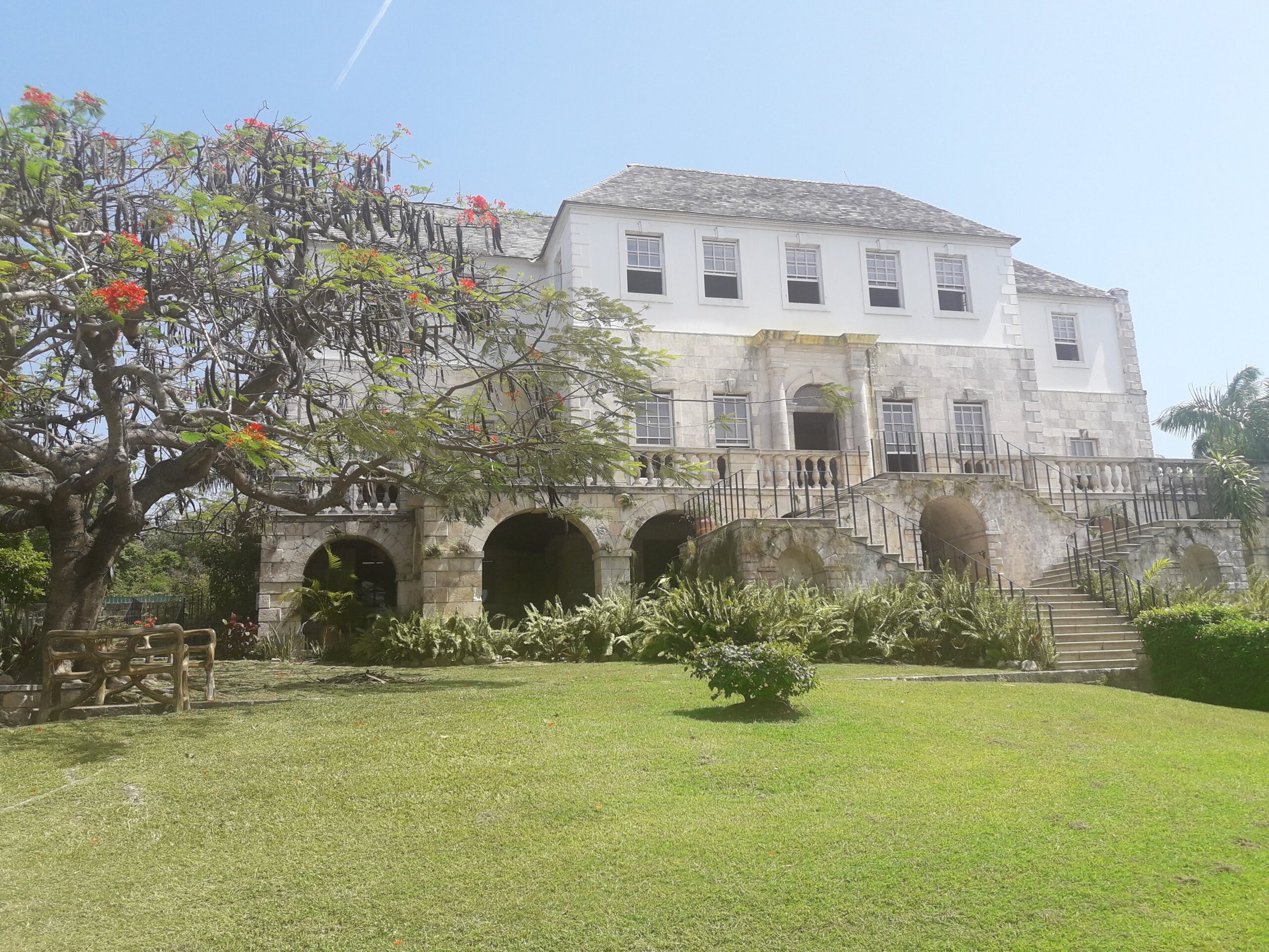 Historic Rose Hall Great House in Montego Bay, Jamaica, a Georgian mansion famous for the legend of Annie Palmer, surrounded by lush tropical gardens and overlooking the Caribbean Sea.