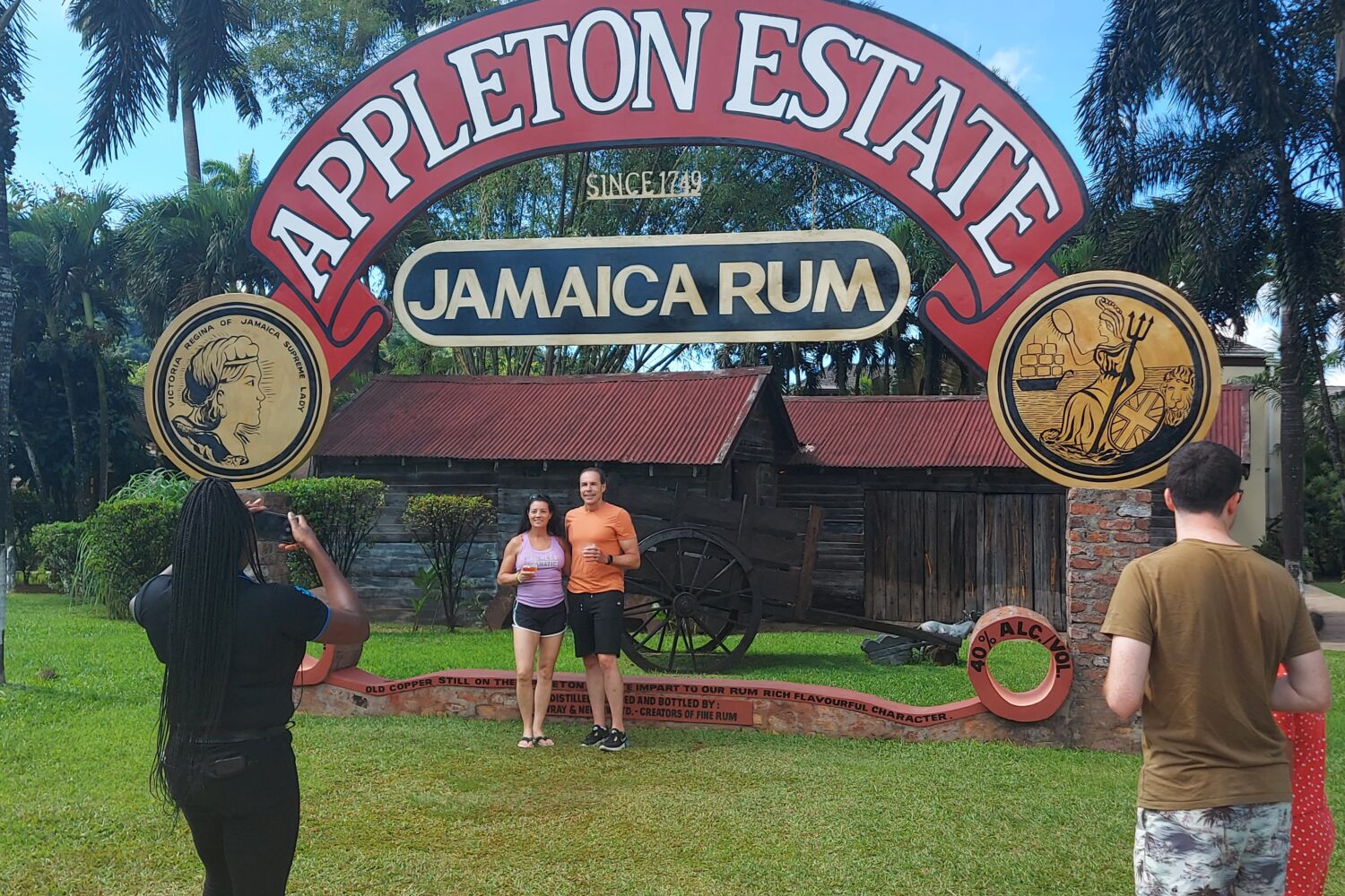 Memories at Appleton Estate A couple poses at the Appleton Estate picture stand as the tour guide takes their photo, while other visitors watch nearby.