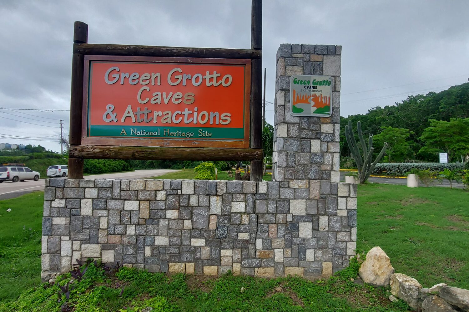 Green Grotto Caves roadside sign positioned across from the entrance to the attraction.
